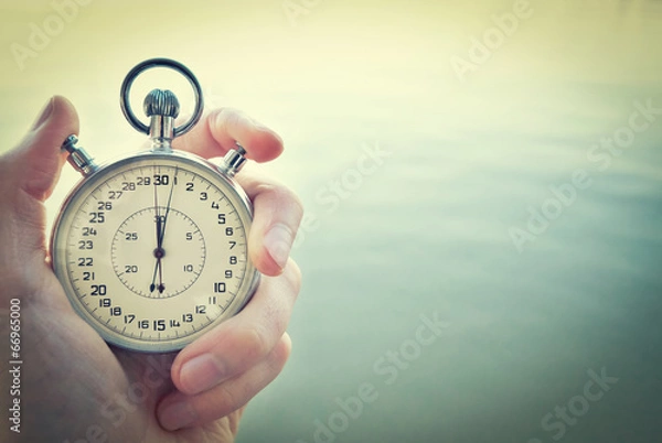 Obraz Old chronometer in man hand, vintage  style