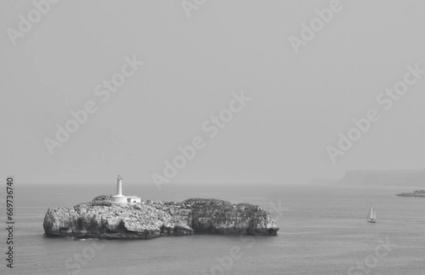 Fototapeta Mouro Island: A Coastal Gem with its Enchanting Lighthouse off Santander's Shoreline