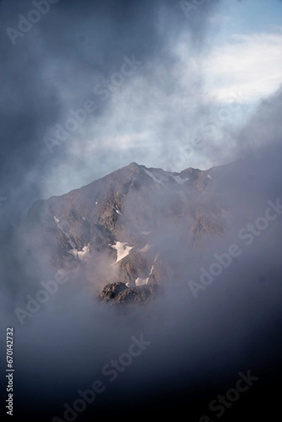 Fototapeta clouds over the mountain