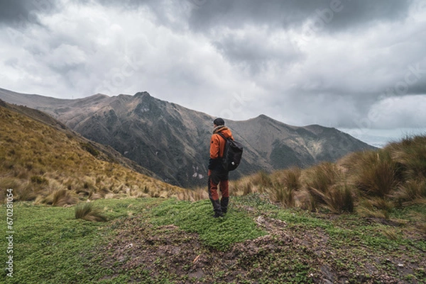 Fototapeta A man stands on top of the Pichincha volcano in Quito, Ecuador.