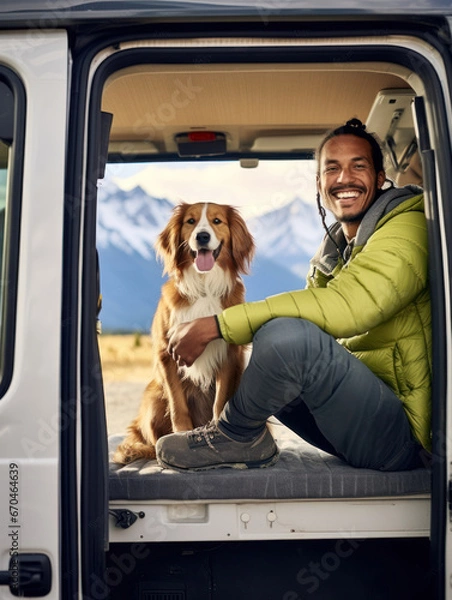 Obraz happy dog with owner sitting in their camper van