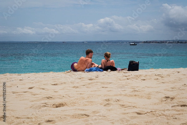 Obraz Deitados na praia