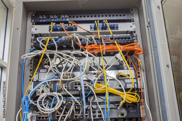 Fototapeta Rack Main Server Internet Connected with Cluttered LAN cables.