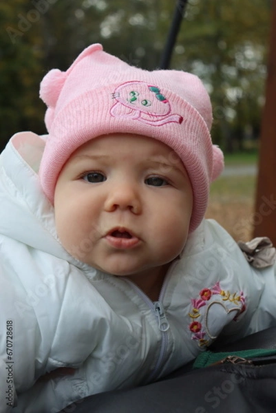 Obraz little girl 8 months old walks in an autumn park in Krakow in Poland