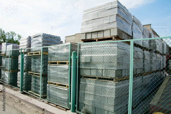 Fototapeta Packed cinder blocks outdoors in racks.