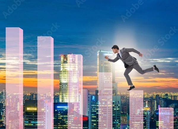 Fototapeta Businessman climbing bar charts in growth concept