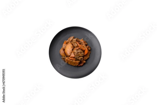 Obraz Delicious vegetable stew of potatoes, beef meat, mushrooms, carrots, salt, spices and herbs