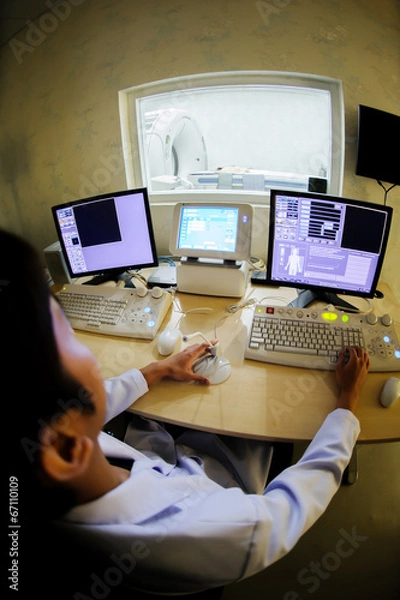 Fototapeta veterinarian doctor working in CT scanner computer control