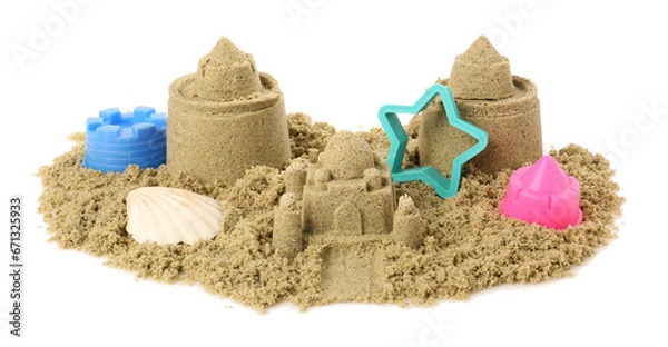 Fototapeta Pile of sand with beautiful castles, plastic toys and shell isolated on white