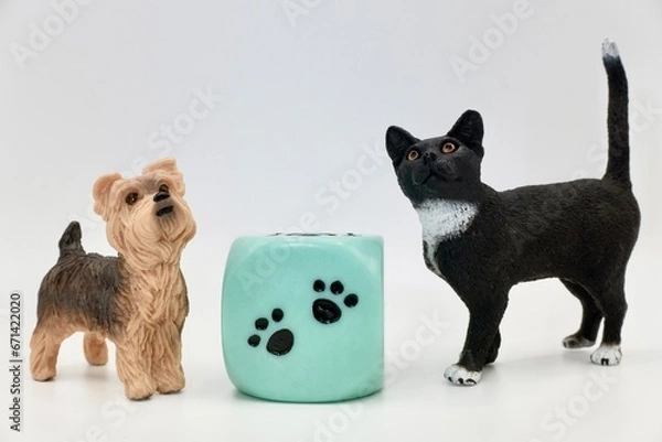 Fototapeta A dog and a cat miniature figurines toys