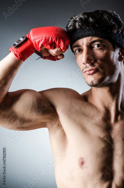 Fototapeta Muscular boxer wiith red gloves
