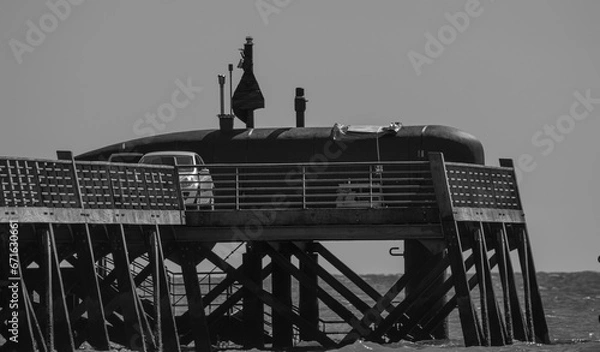 Obraz Black and white photo of a fake submarine on the Saint-Jean-de-Monts pontoon that was used as a film set for the film À toute allure.