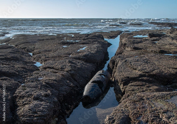 Obraz November 2022, the remains of a shell in overview, dating from the Second World War in the reefs of the beach of La Sauzaie, Vendée FRANCE.