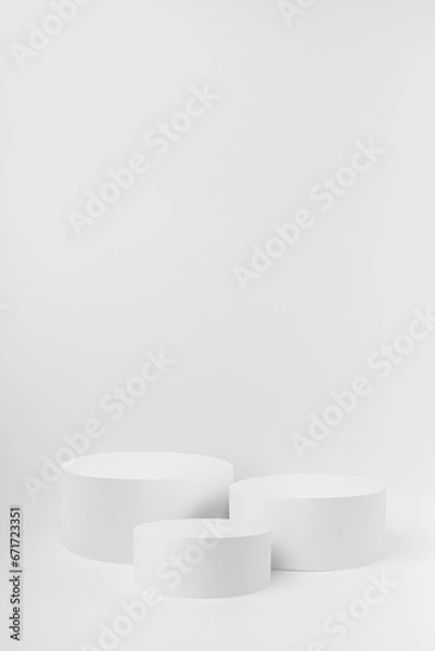 Fototapeta Abstract three white round podiums for cosmetic products as mockup on white background. Scene for presentation products, gifts, goods, advertising, design, sale, text, display, showing.