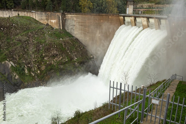 Fototapeta Canicada dam water discharge due to excessive rain in recent days - 02 November 2023. "Barragem da Canicada" is located in Minho region, North of Portugal