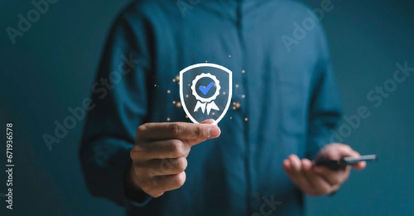 Fototapeta Quality Assurance, Hand shows the sign of the top service Quality assurance, Guarantee, Standards, ISO certification and standardization concept. improvement certification Compliance to regulations.