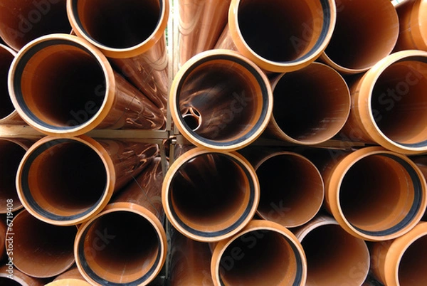Obraz PVC pipes stacked in construction site