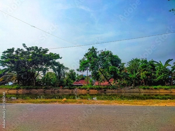 Obraz road next to irrigation