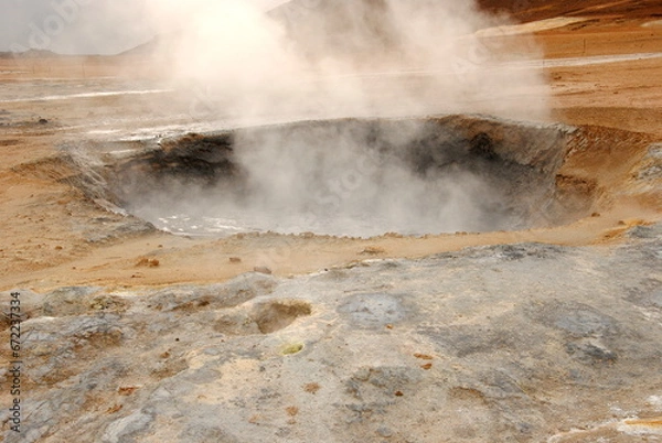 Fototapeta Smoking mudpool surrounded by sulphur crystals in Námafjall Geothermal Area, or Hverir, on the east side of Lake Mývatn in Northeast Iceland