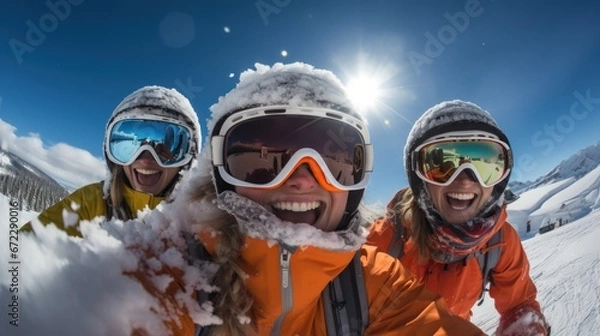 Fototapeta Group of friends having fun in the snow on a sunny day.