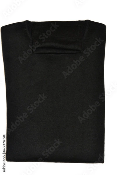 Fototapeta folded black merino wool sweater with high neck on isolated background