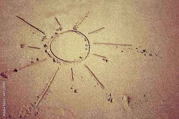 Obraz sol dibujado en la arena
