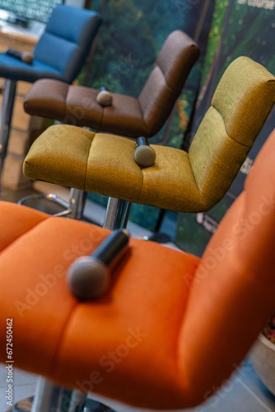 Fototapeta close-up of colorful chairs on which microphones lie