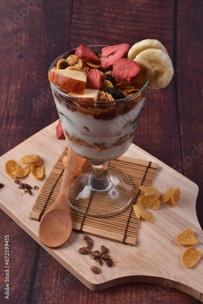 Fototapeta Delicious Yogurt Ice Cream with Fruits in a Glass