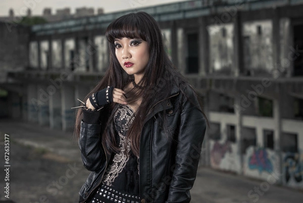 Obraz Asian woman in emo goth clothes at an abandoned building