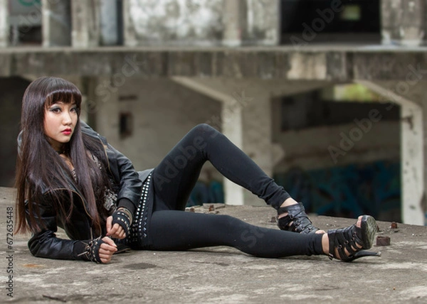 Obraz Asian woman in emo goth clothes at an abandoned building