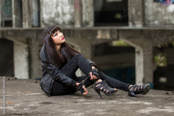 Obraz Asian woman in emo goth clothes at an abandoned building
