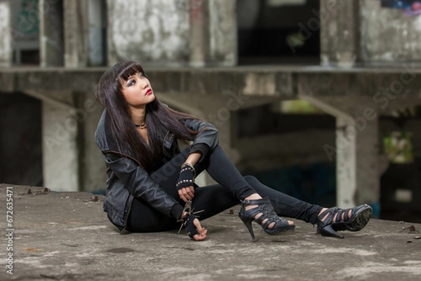 Obraz Asian woman in emo goth clothes at an abandoned building