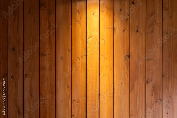 Obraz 【背景】スポットライトに照らされた山小屋の壁のようなナチュラルな茶色の木目の背景素材