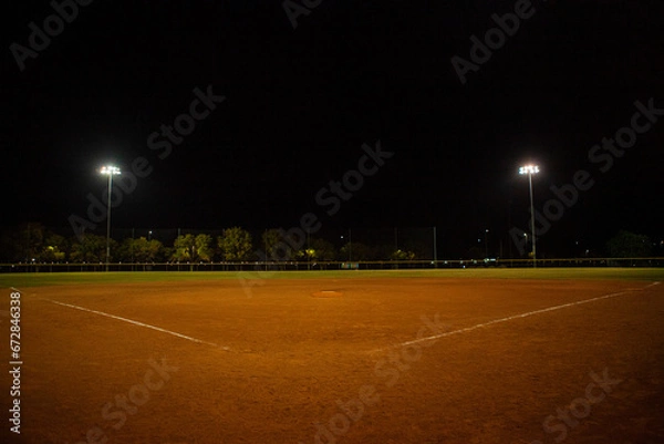 Obraz Empty baseball field at night, view from home plate