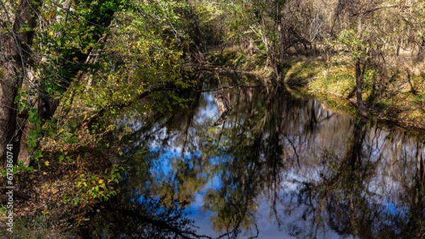 Fototapeta Scenic view of Calumet Creek near Clarksville, Missouri with surrounding landscape reflected in its waters