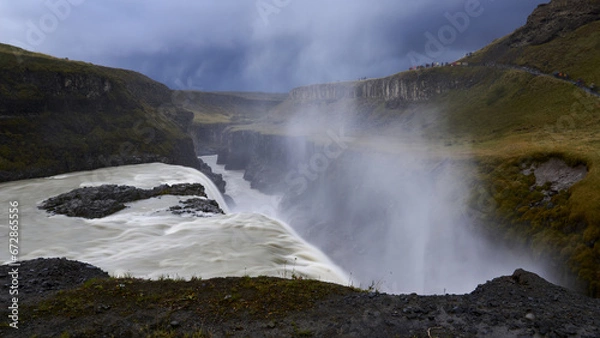 Fototapeta dark clouds gathering mighty gullfoss in iceland