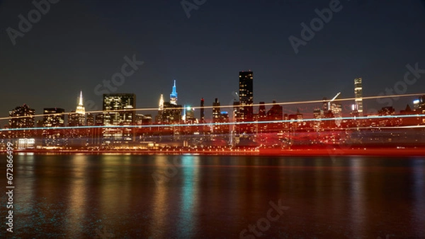 Fototapeta ferry passing by gantry park in front of Manhattan skyline