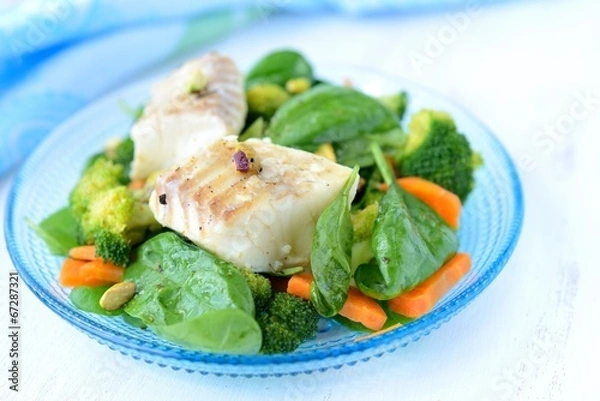 Fototapeta Braised fish (haddock) with vegetables.