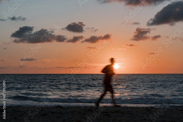 Obraz Sunrise Stride: A Jogger's Journey Along the Beach