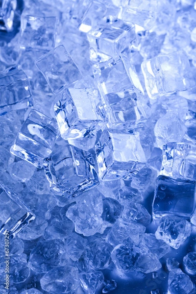 Fototapeta Ice cubes on blue background 