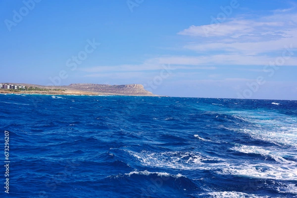Fototapeta View of the mountain peak from a sailing boat.