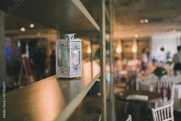 Fototapeta a lamp staying on a shelf of a cupboard