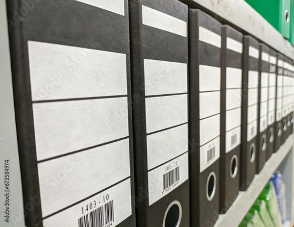 Fototapeta black binder folder on rack side angle