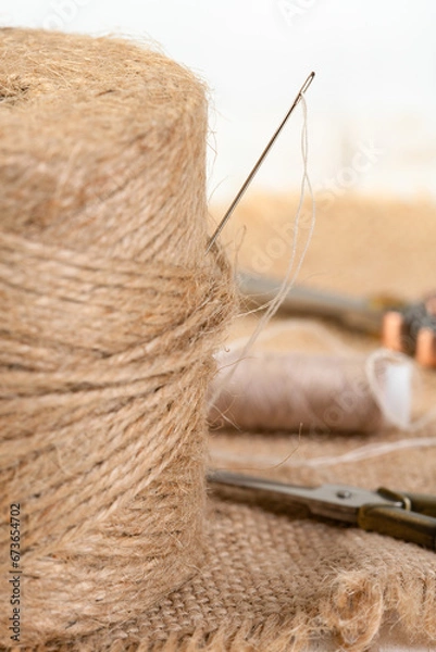 Fototapeta Spool of string and a needle