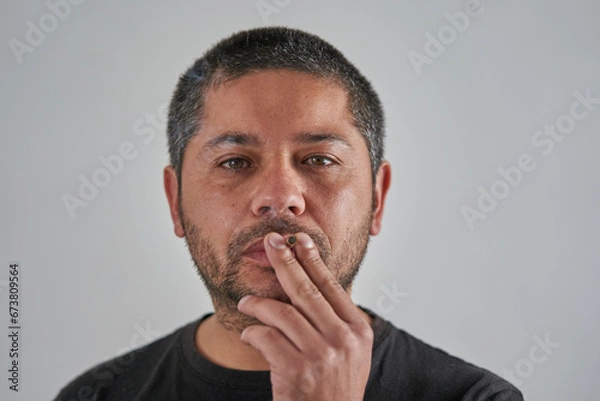 Obraz Smoking Man on a White Background