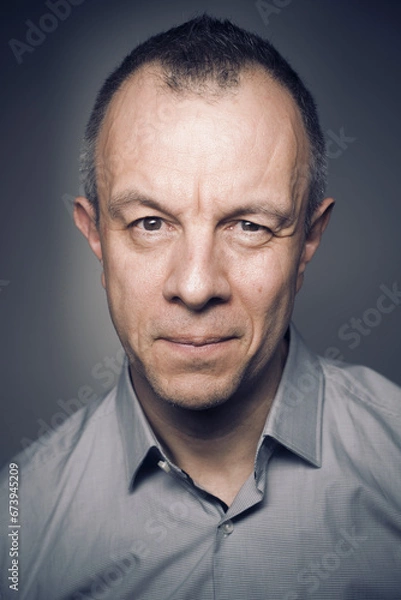 Obraz Studio shot portrait man 50s pensive expression