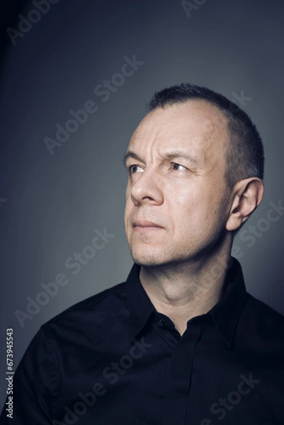 Obraz Studio shot portrait man 50s pensive expression