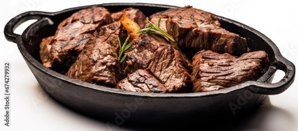 Fototapeta Slow cooked beef and lamb offal including heart lungs and liver served in a thick black cast iron vessel