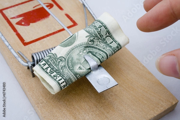 Obraz Money Trap - US Dollar being taken from a rat trap
