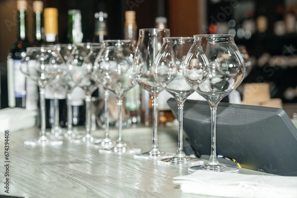 Fototapeta Bottles of wine. Wine glasses.  Wine cellar. Wine library.